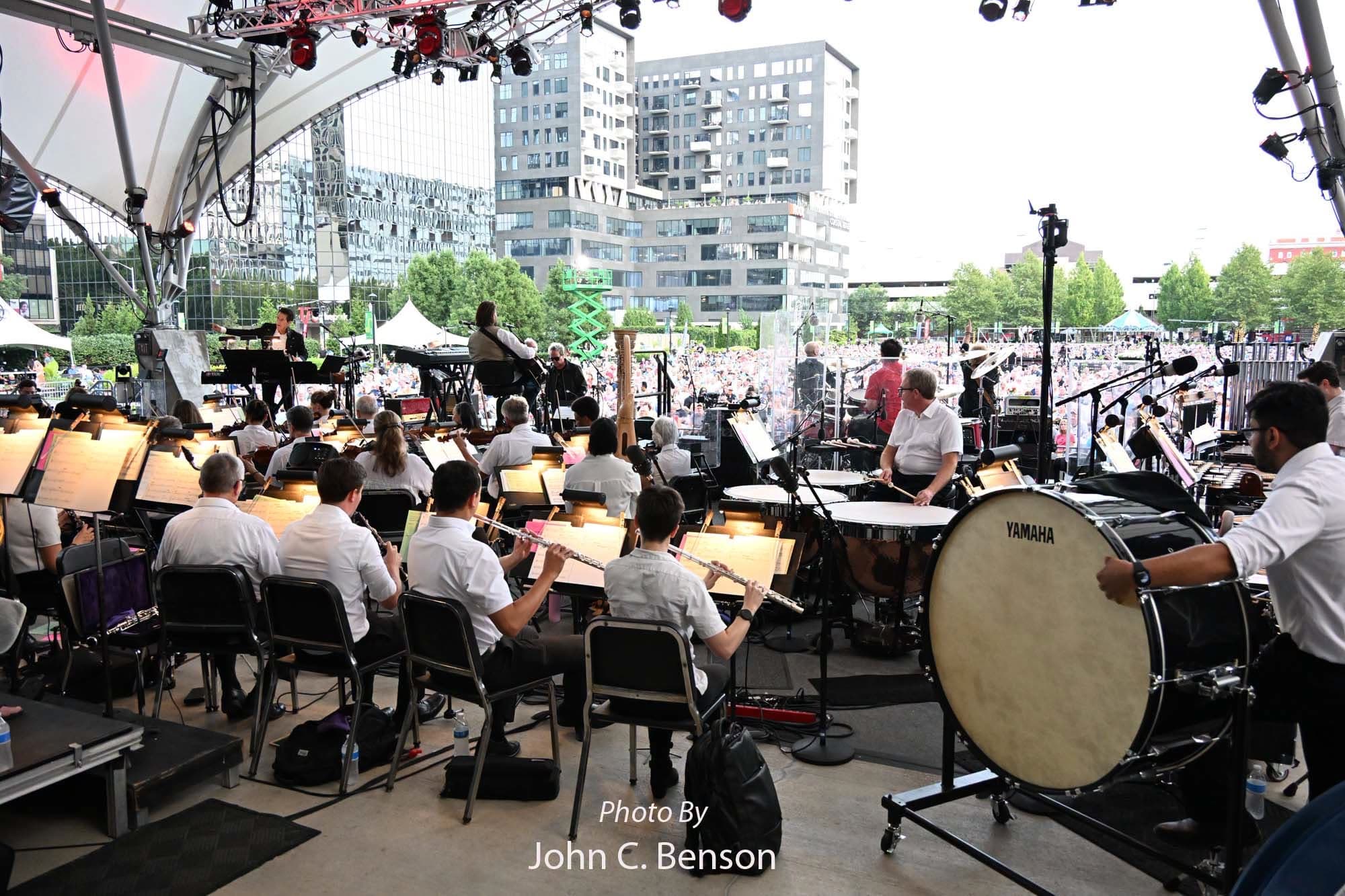 The orchestra onstage viewed from behind the percussion section
